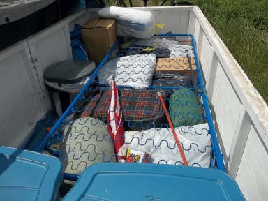 cot and cargo inside camping trailer